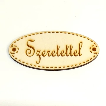 Ovális fa táblácska 'Szeretettel' felirattal. Mérete: 8x3,7 cm